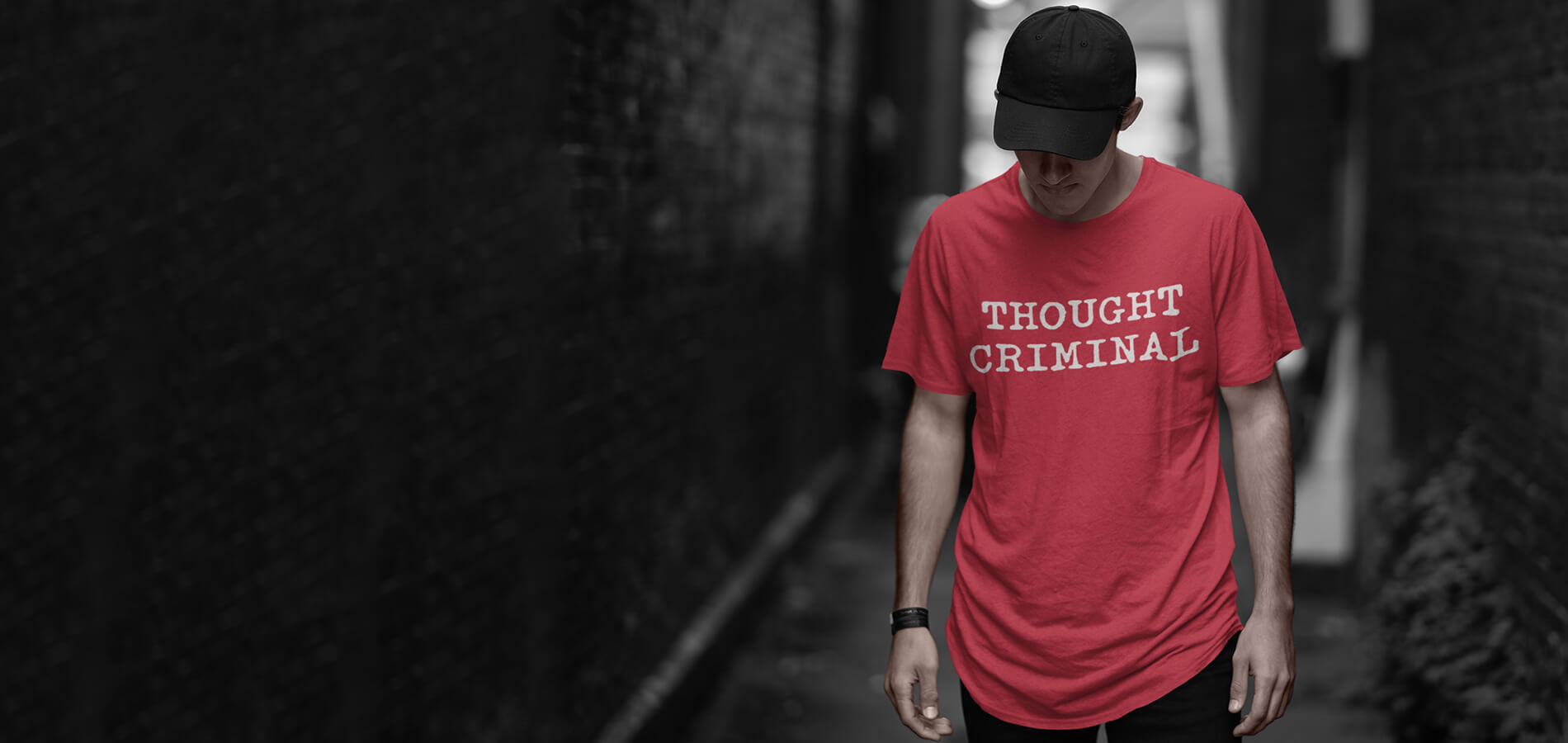 man wearing thought criminal t-shirt