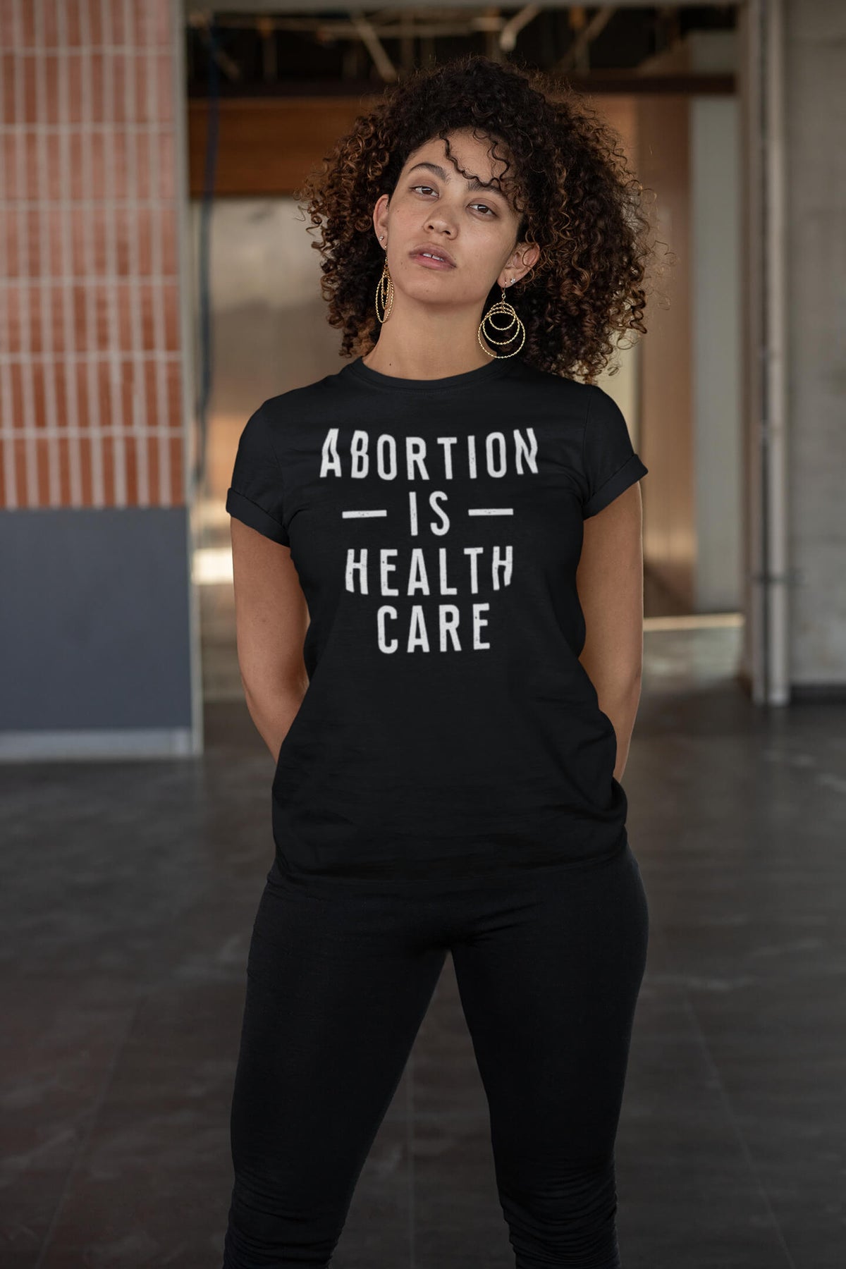 woman wearing abortion is health care t-shirt